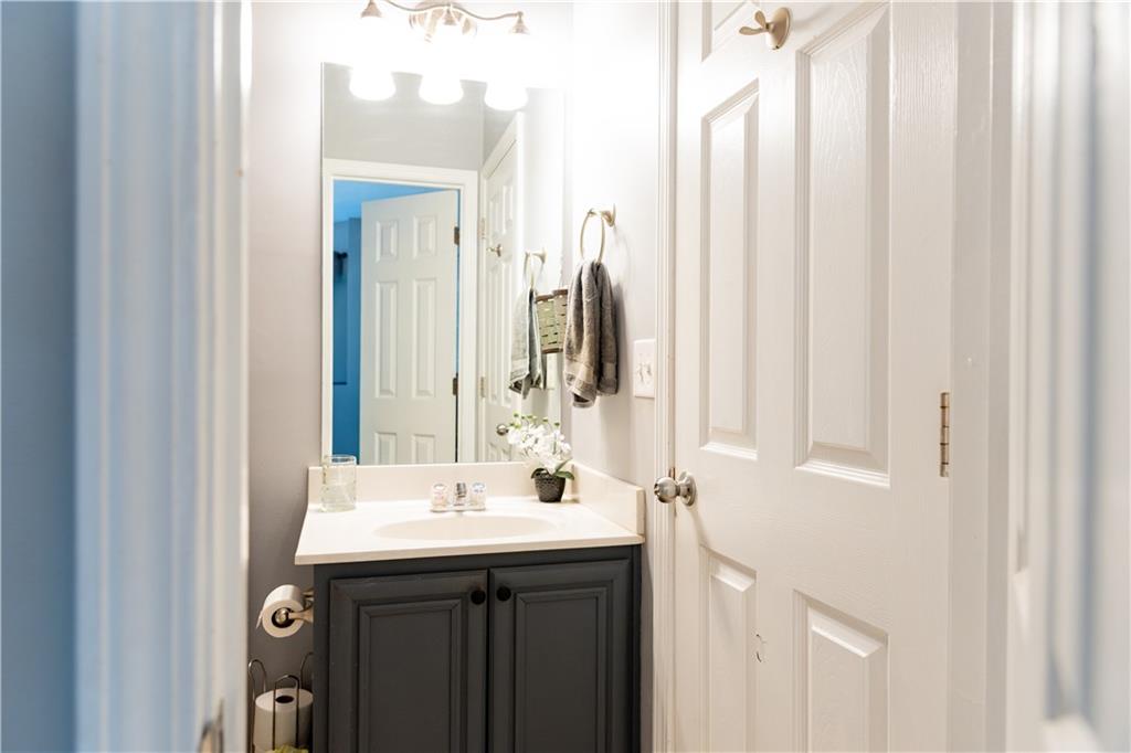 417 Farmwood Way Canton, GA 30115 - Photo 11 of 33 a bathroom with a sink and a mirror