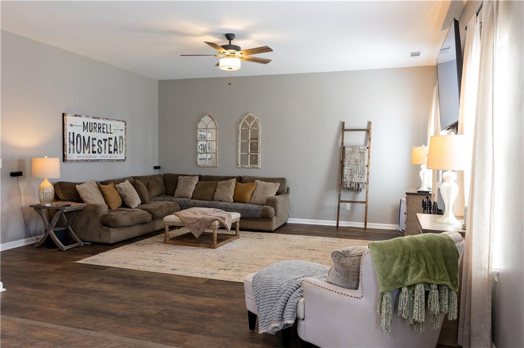 417 Farmwood Way Canton, GA 30115 - Photo 12 of 33 a living room with furniture and a lamp