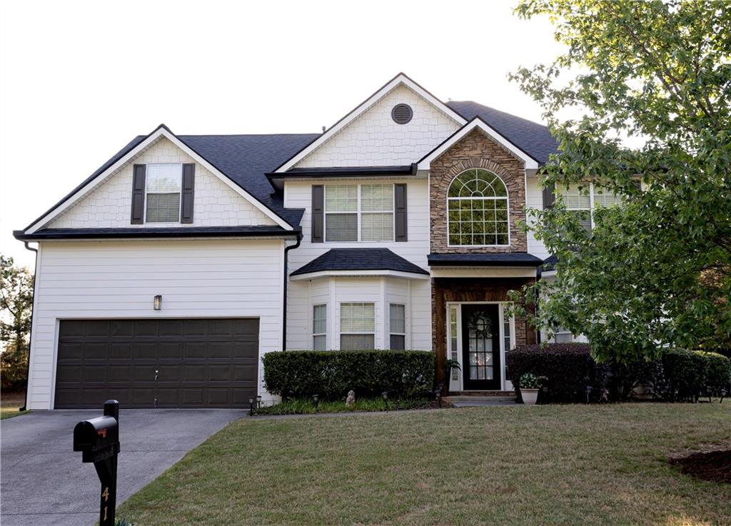 417 Farmwood Way Canton, GA 30115 - Photo 2 of 33 a front view of a house with a yard