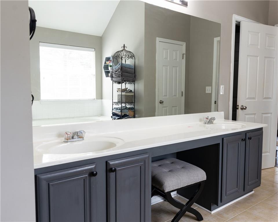 417 Farmwood Way Canton, GA 30115 - Photo 23 of 33 a bathroom with a sink and a mirror