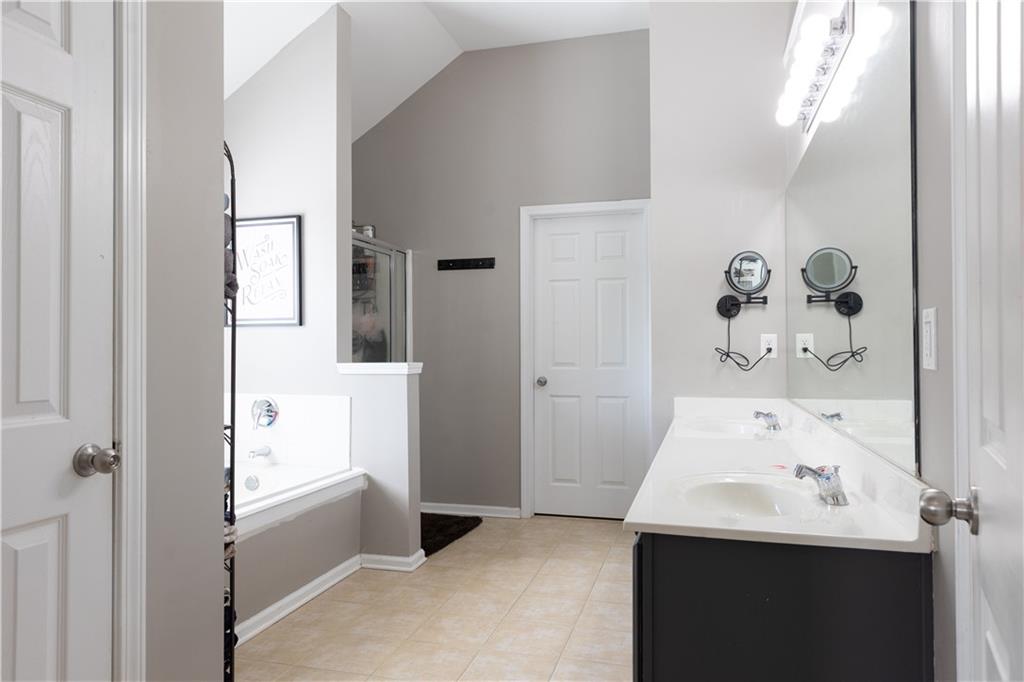 417 Farmwood Way Canton, GA 30115 - Photo 24 of 33 a bathroom with a sink and mirror