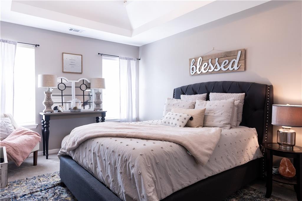 417 Farmwood Way Canton, GA 30115 - Photo 26 of 33 a bedroom with bed and a night stand