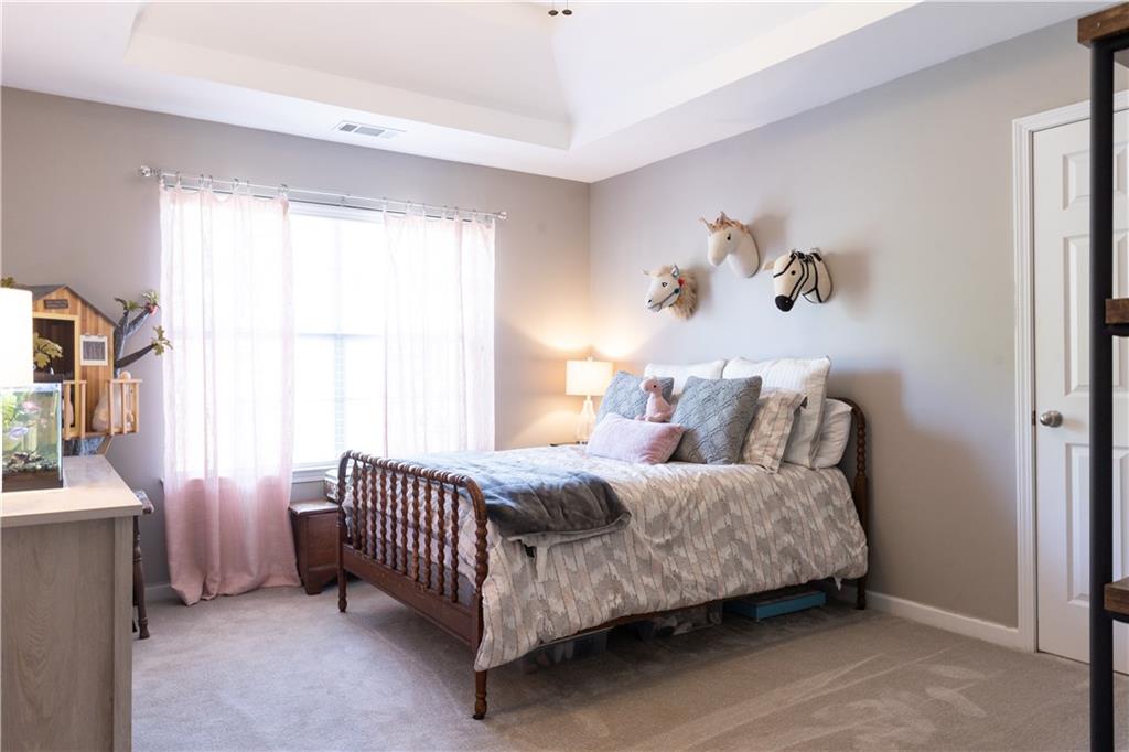 417 Farmwood Way Canton, GA 30115 - Photo 27 of 33 a bedroom with a bed and a window