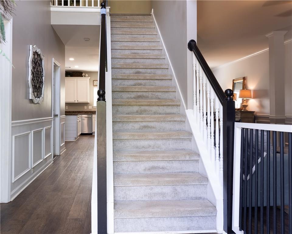 417 Farmwood Way Canton, GA 30115 - Photo 5 of 33 a view of a hallway with wooden floor and staircase