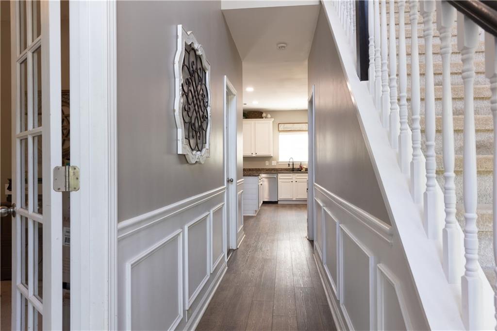 417 Farmwood Way Canton, GA 30115 - Photo 8 of 33 a view of a hallway with wooden floor and entryway