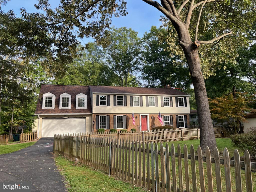 a house that has a tree in front of it