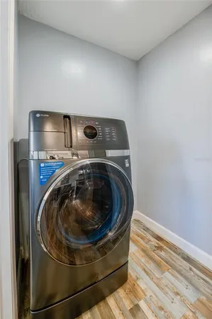 a utility room with washing machine