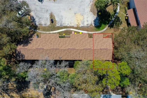 an aerial view of a yard with a barn