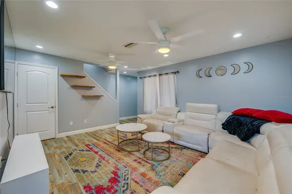 a living room with furniture and a rug
