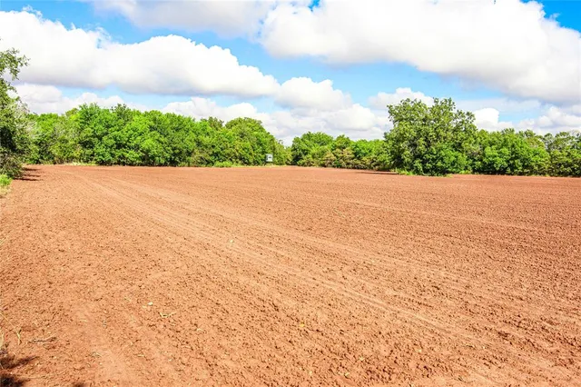 a kitchen with a refrigerator and a table