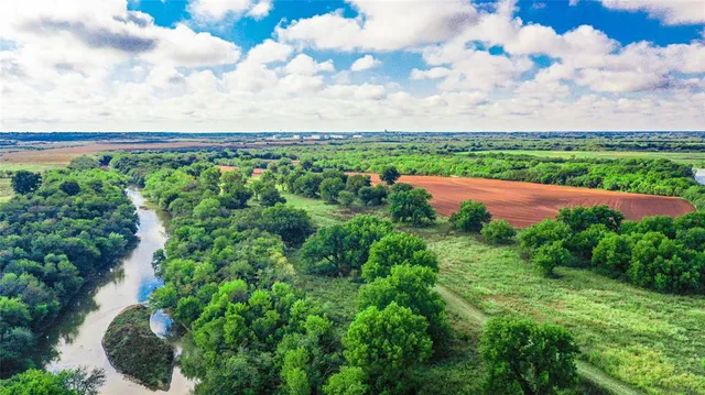 a view of a yard with an outdoor seating