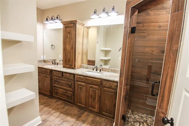 a view of an empty room and wooden floor