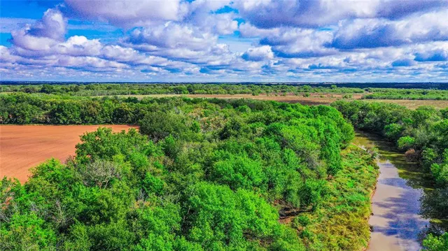 a view of a swimming pool with an outdoor space and seating area