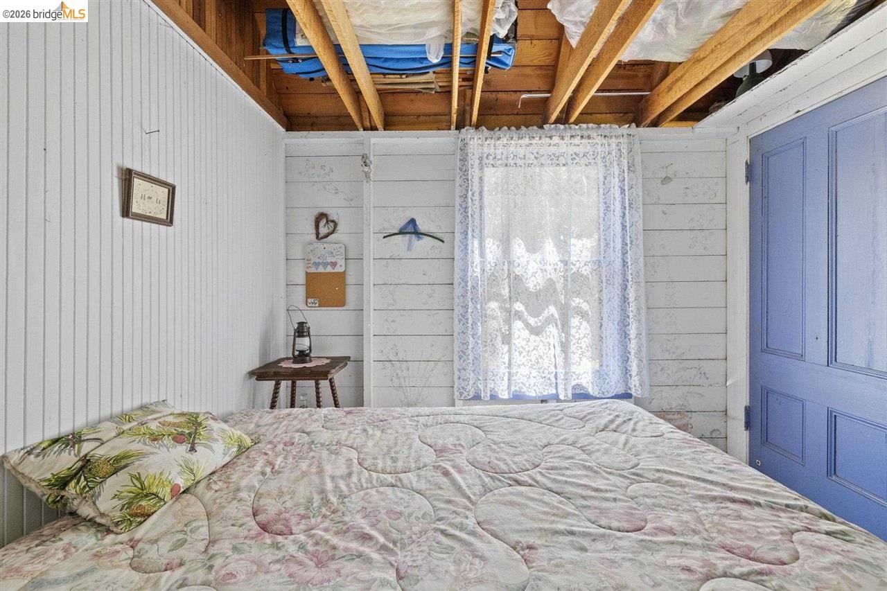 7 Riverside Tract Kyburz, CA 95720 - Photo 15 of 25 a bedroom with a bed and a window