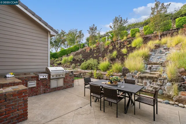 a view of a tables and chairs in a patio
