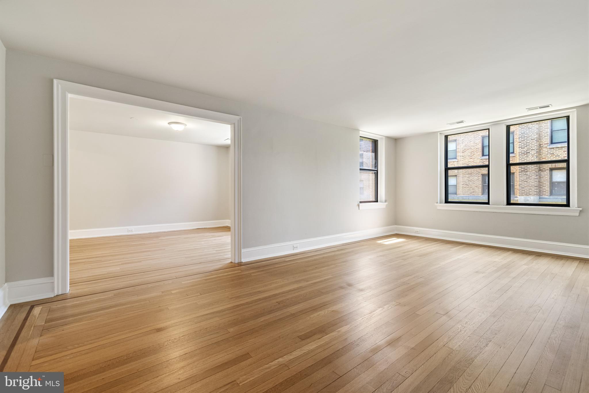 900 Valley Road, Unit A202 Melrose Park, PA 19027 - Photo 9 of 29 Great room leading to dining room