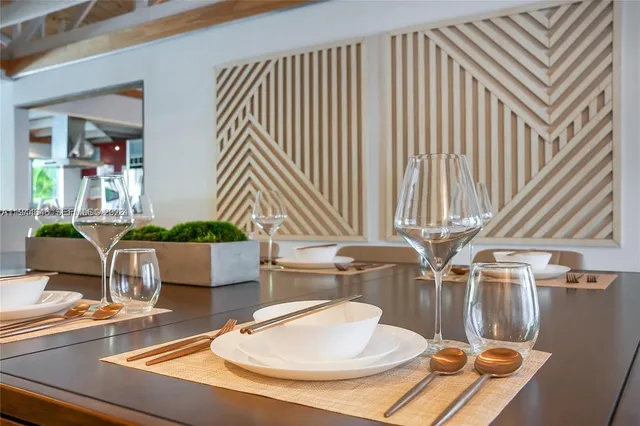 a dining room with table and chairs