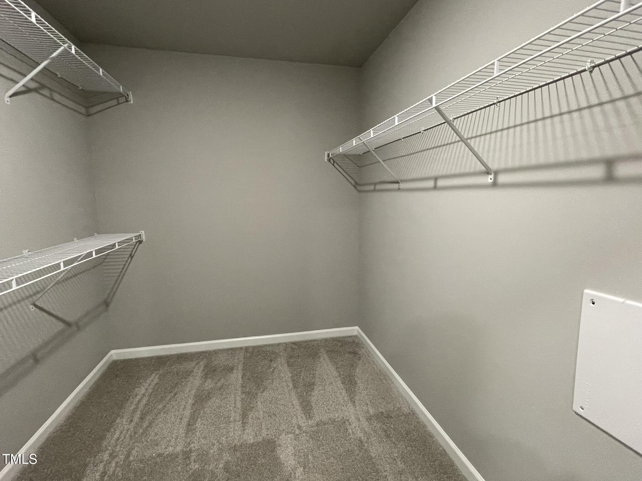 79 Tulipfield Way Benson, NC 27504 - Photo 12 of 19 a view of a room with racks on the wall