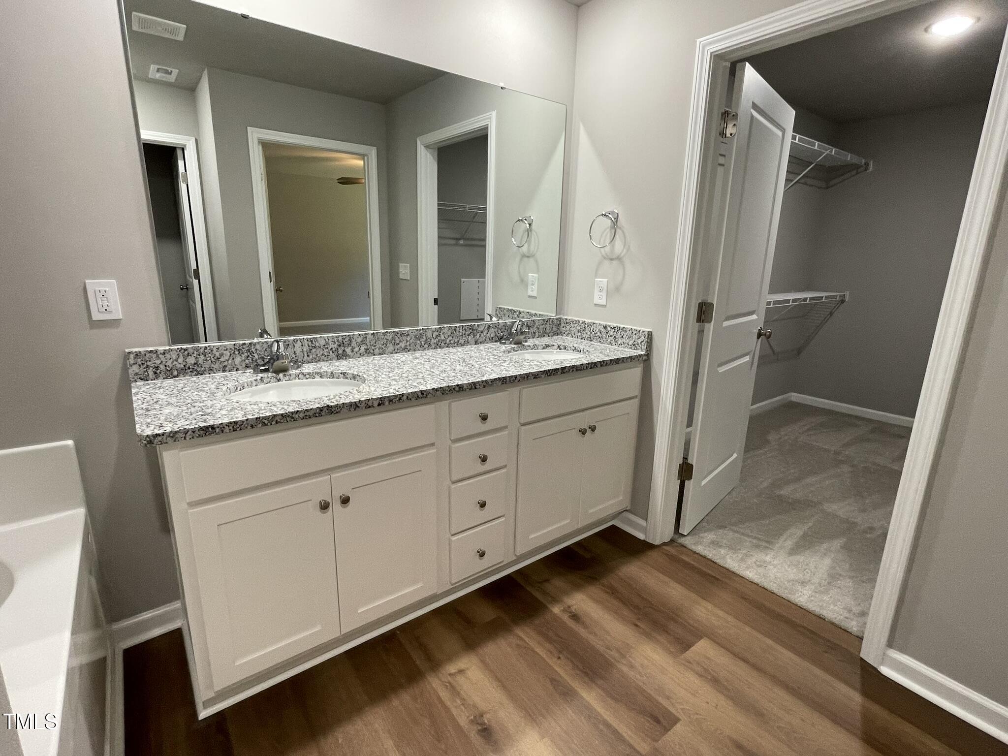 79 Tulipfield Way Benson, NC 27504 - Photo 13 of 19 a bathroom with a granite countertop sink toilet and mirror