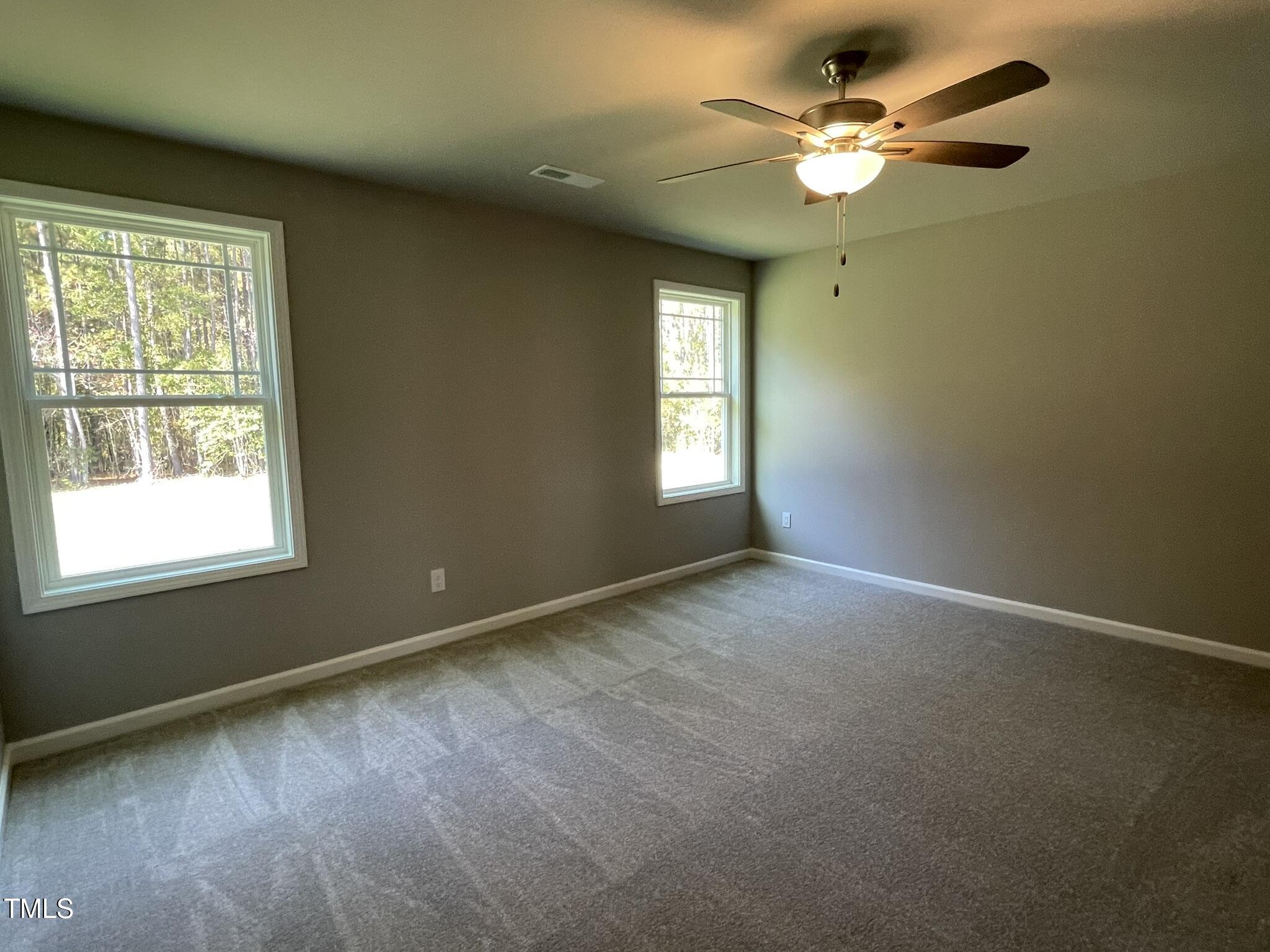 79 Tulipfield Way Benson, NC 27504 - Photo 15 of 19 a view of an empty room with a window
