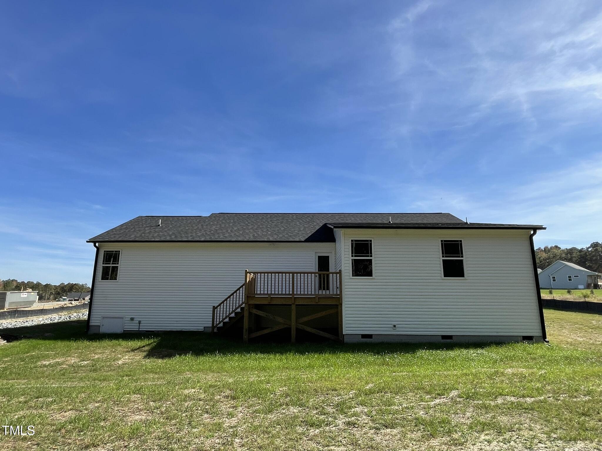 79 Tulipfield Way Benson, NC 27504 - Photo 17 of 19 a view of a backyard with a garden