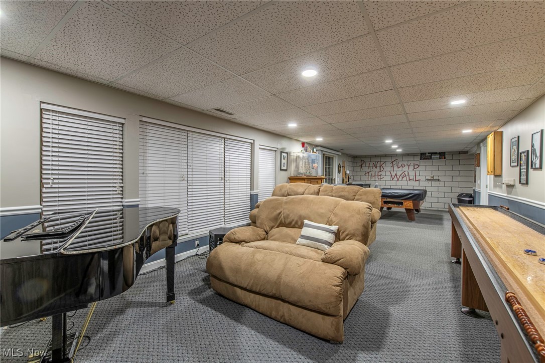 11112 Prouty Road, Unit B Painesville, OH 44077 - Photo 24 of 31 Rec room featuring a paneled ceiling and carpet flooring