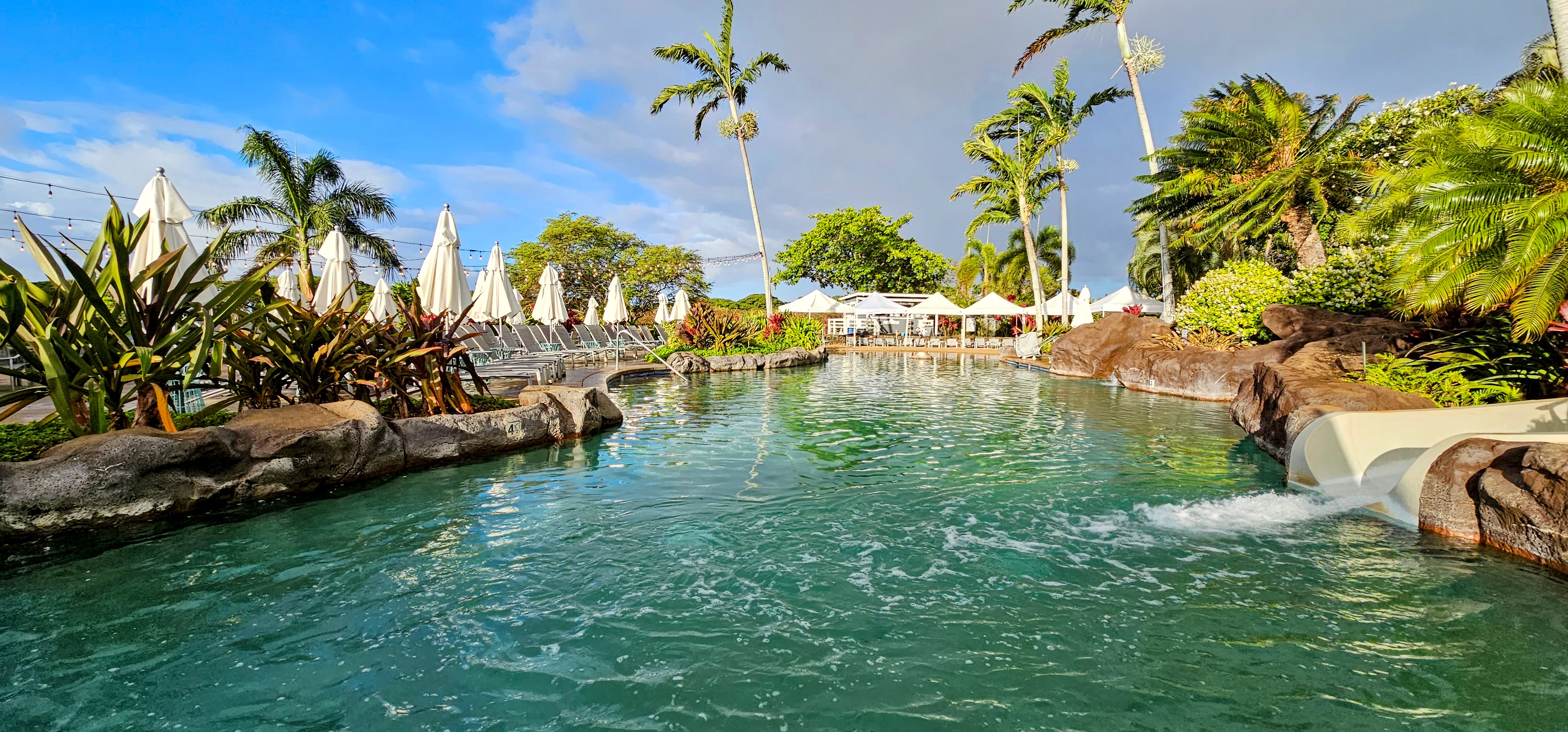 2253 Poipu Road, Unit 411 Koloa, HI 96756 - Photo 17 of 20 a view of yard with swimming pool and lawn chairs