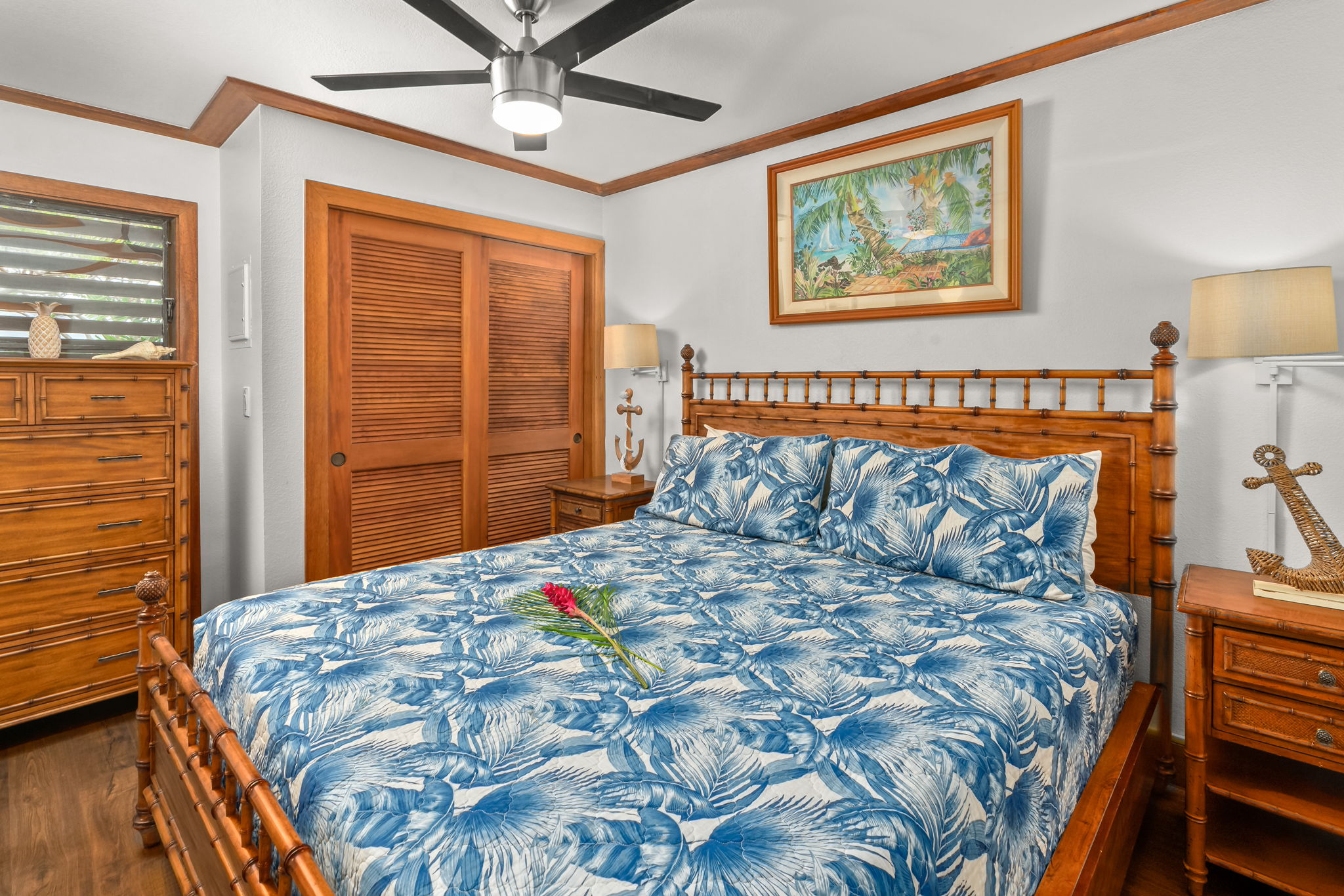 2253 Poipu Road, Unit 411 Koloa, HI 96756 - Photo 3 of 20 a bed sitting in a bedroom next to a window