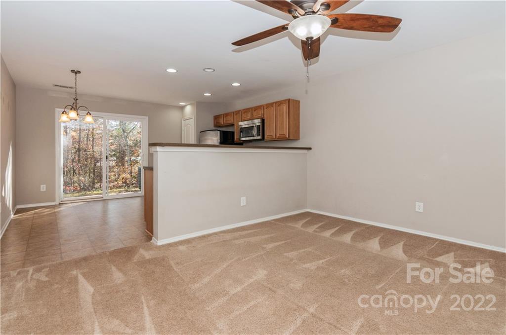 447 Hunters Dance Road, Unit 27 Fort Mill, SC 29708 - Photo 11 of 38 a view of an empty room with a window