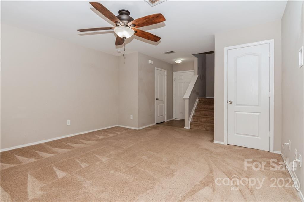 447 Hunters Dance Road, Unit 27 Fort Mill, SC 29708 - Photo 13 of 38 an empty room with ceiling fan and window