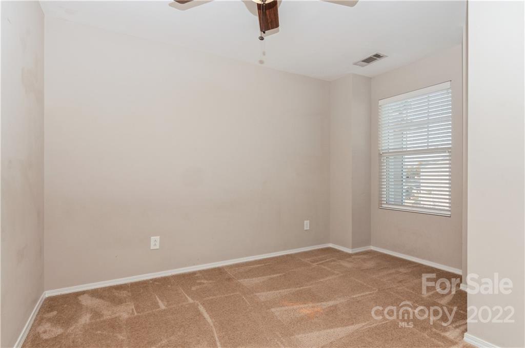 447 Hunters Dance Road, Unit 27 Fort Mill, SC 29708 - Photo 17 of 38 a view of an empty room with a window