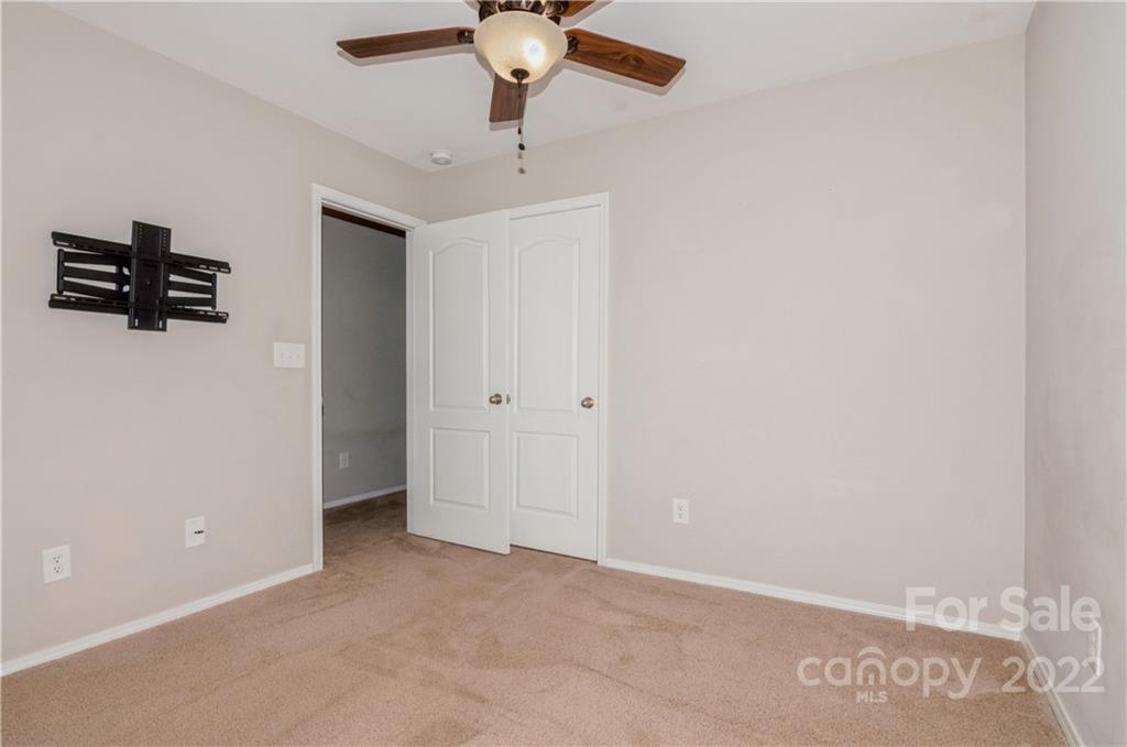 447 Hunters Dance Road, Unit 27 Fort Mill, SC 29708 - Photo 18 of 38 an empty room with a ceiling fan