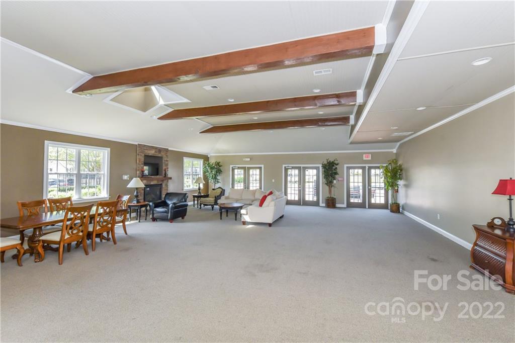 447 Hunters Dance Road, Unit 27 Fort Mill, SC 29708 - Photo 32 of 38 a living room with furniture and a large window