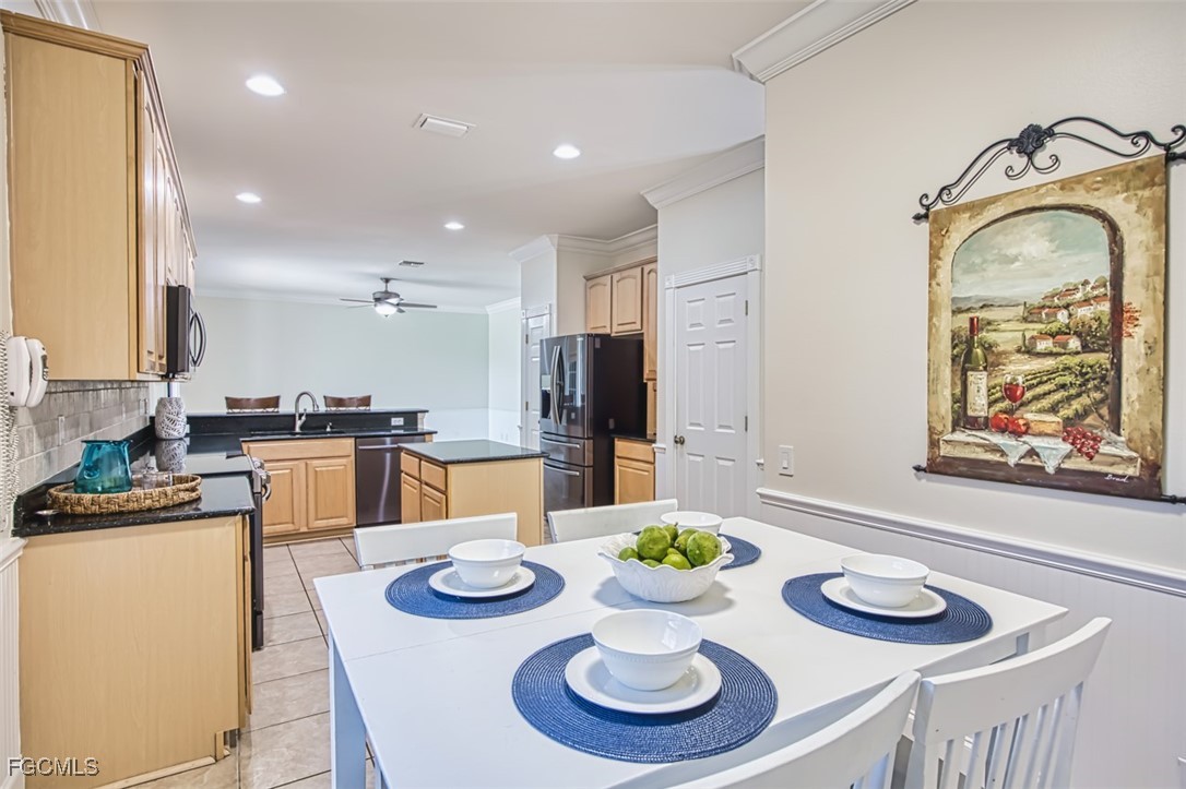 8916 Fawn Ridge Drive Fort Myers, FL 33912 - Photo 14 of 49 a kitchen with furniture and dining table