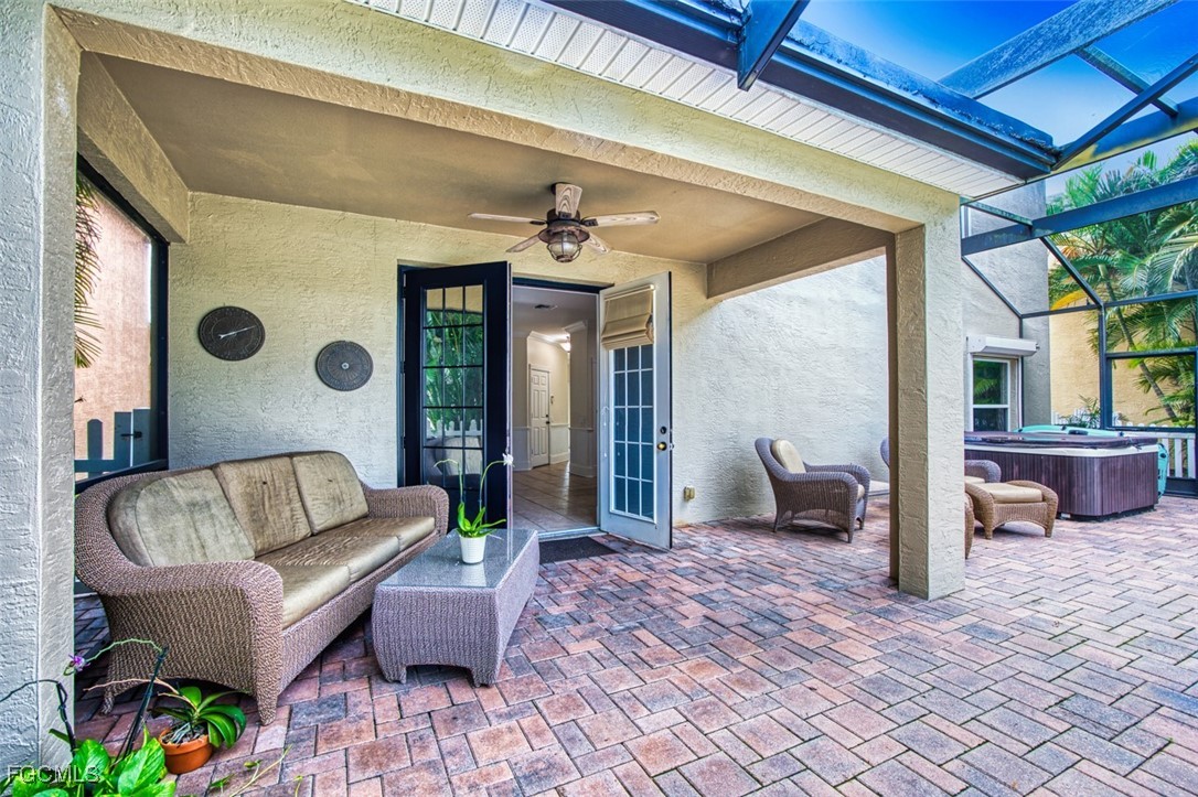 8916 Fawn Ridge Drive Fort Myers, FL 33912 - Photo 20 of 49 a outdoor living space with patio furniture and a potted plant