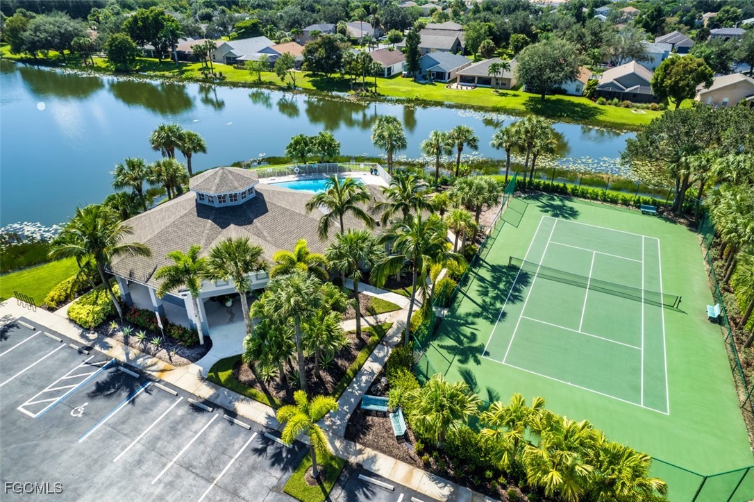 8916 Fawn Ridge Drive Fort Myers, FL 33912 - Photo 45 of 49 a view of a lake with a building in front of it