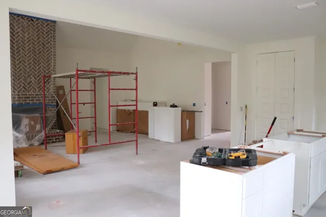 a bedroom with furniture and a sink