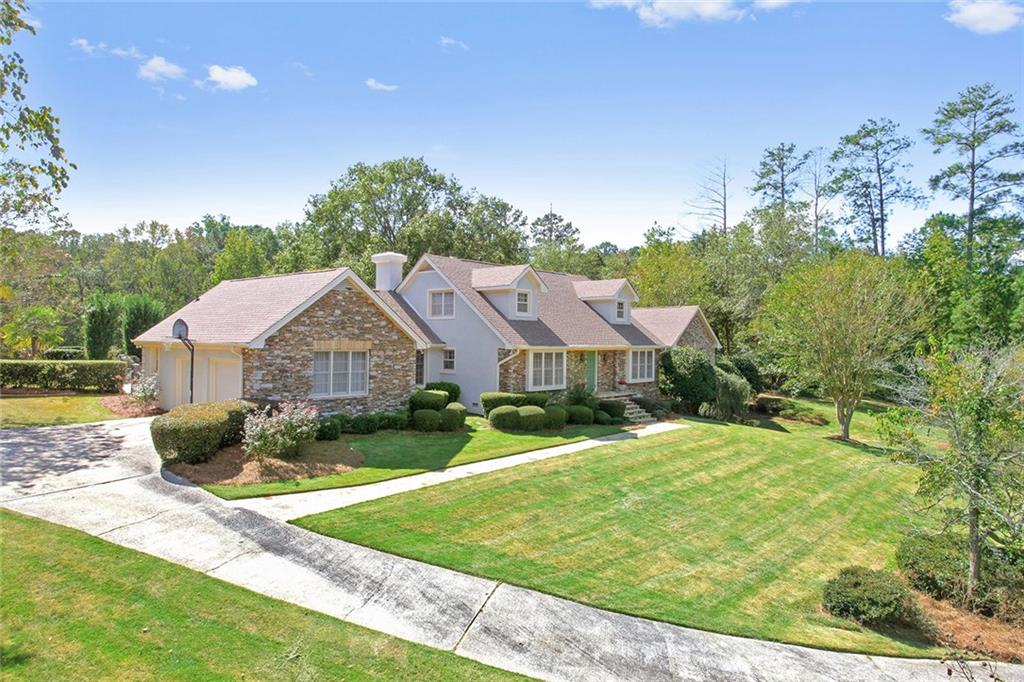 Gorgeous 4.6 Acres private estate with great front setback, stacked stone front/stucco, flagstone front walkway, looped driveway, mature garden/tree/shrubs, in-ground pool, separate carriage home. Bring on your family and horses!