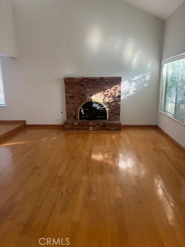 a view of room with window and a fireplace