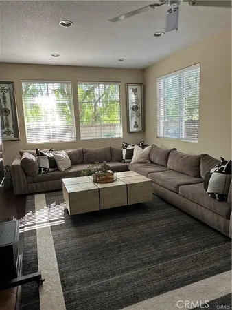a living room with furniture and windows