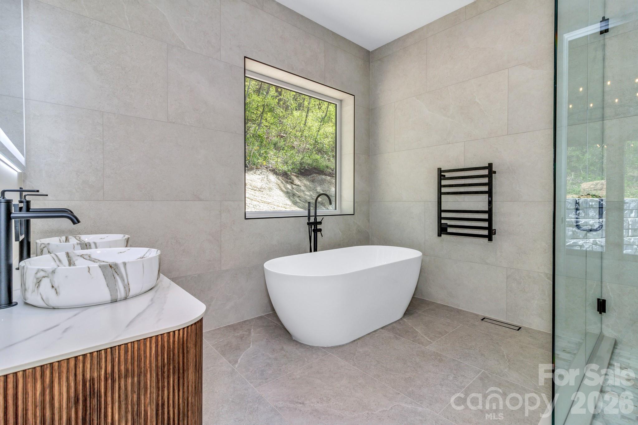 134 View Ridge Parkway Leicester, NC 28748 - Photo 27 of 48 a bathroom with a bathtub sink and toilet