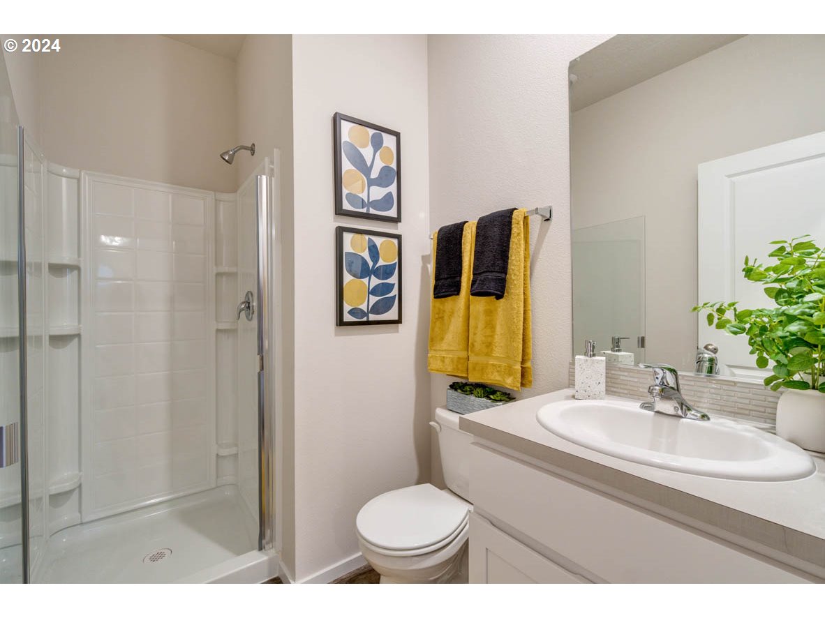 2937 V Street Springfield, OR 97477 - Photo 6 of 30 a bathroom with a sink toilet and shower