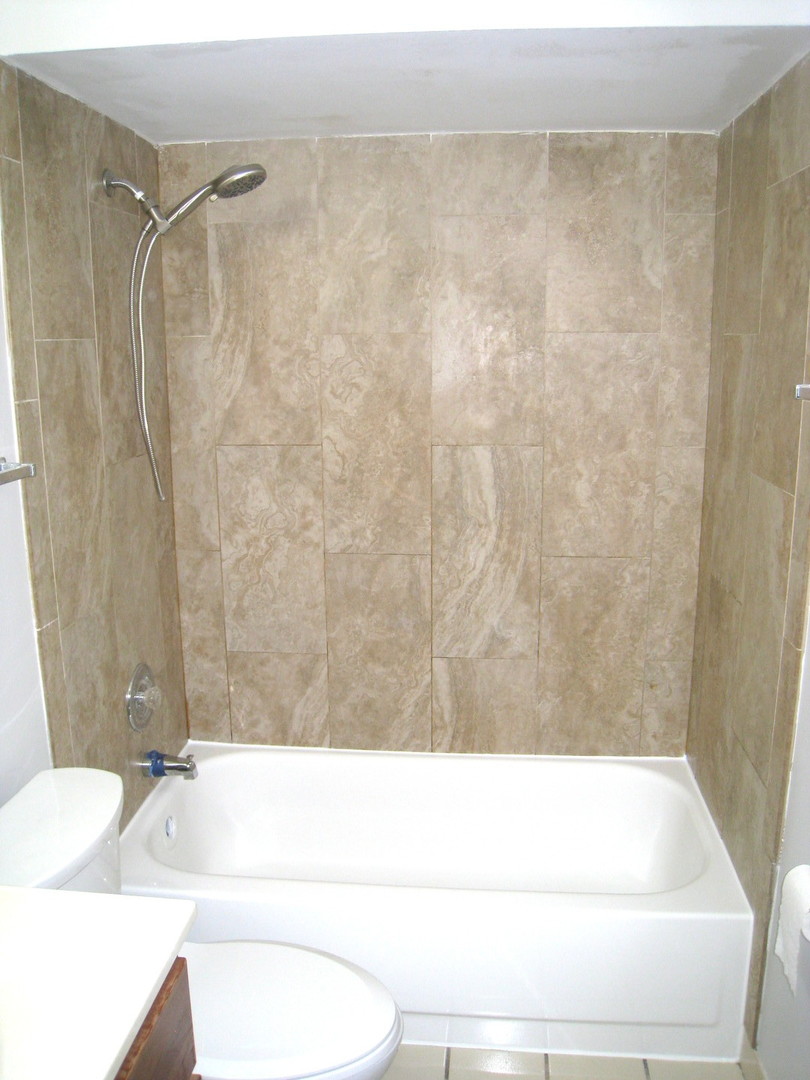 1235 Harding Avenue, Unit 302 Des Plaines, IL 60016 - Photo 17 of 22 a bathroom with a bathtub and a sink