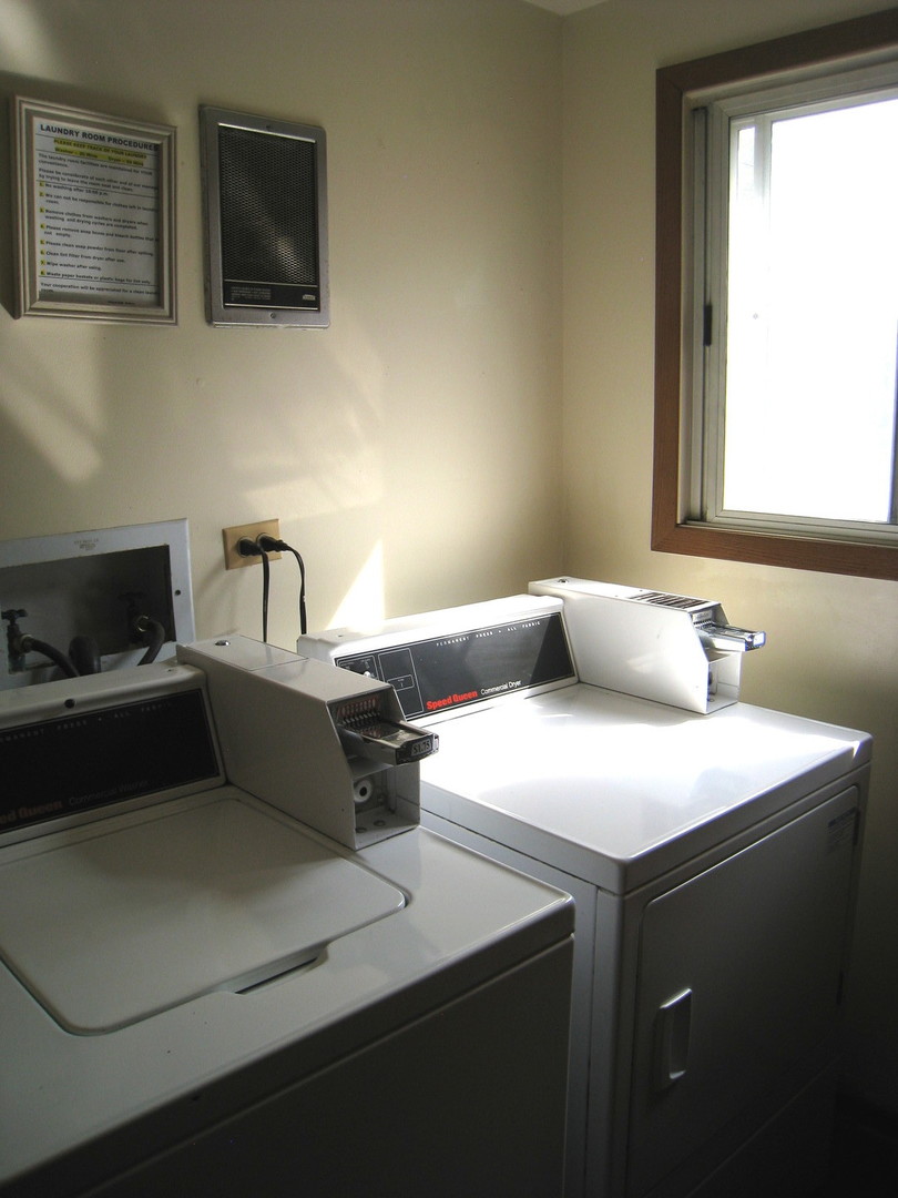 1235 Harding Avenue, Unit 302 Des Plaines, IL 60016 - Photo 19 of 22 a living room with a couch and a flat screen tv