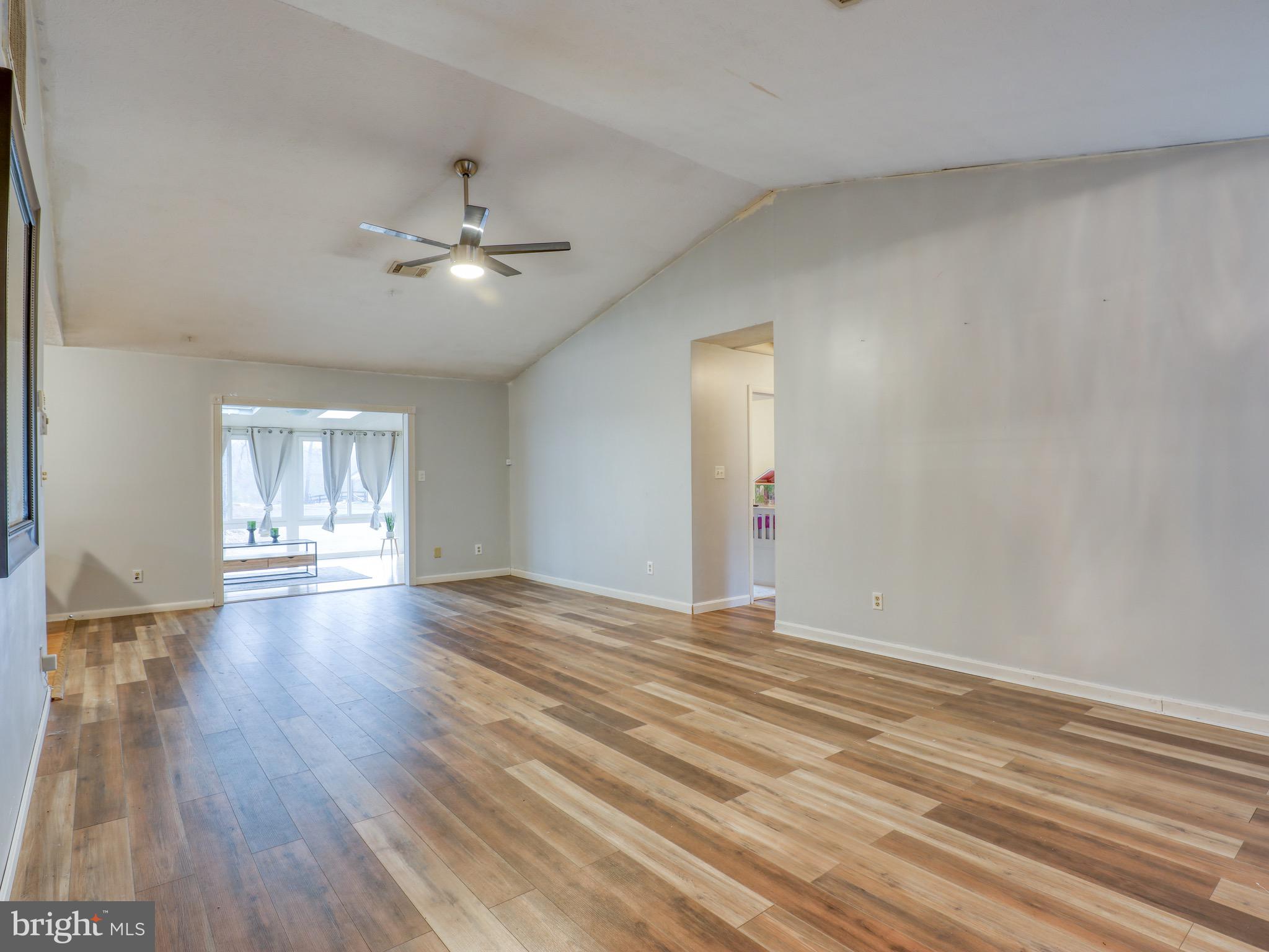 137 Holiday Road Cross Junction, VA 22625 - Photo 5 of 42 Living room heading into sunroom