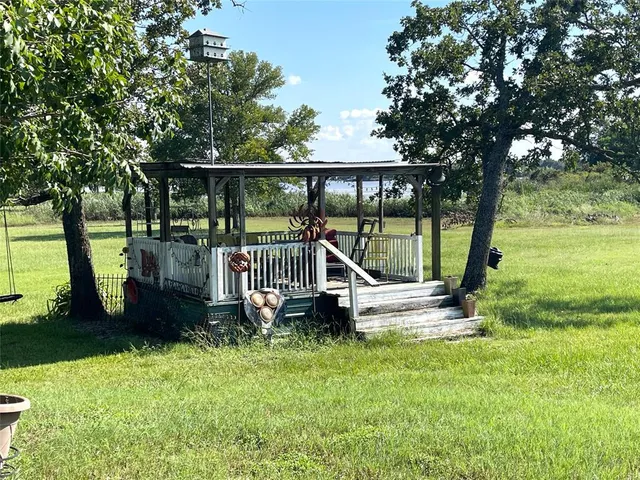 a view of a lake with houses in the background