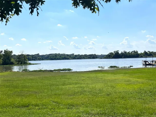 a view of a lake with a big yard