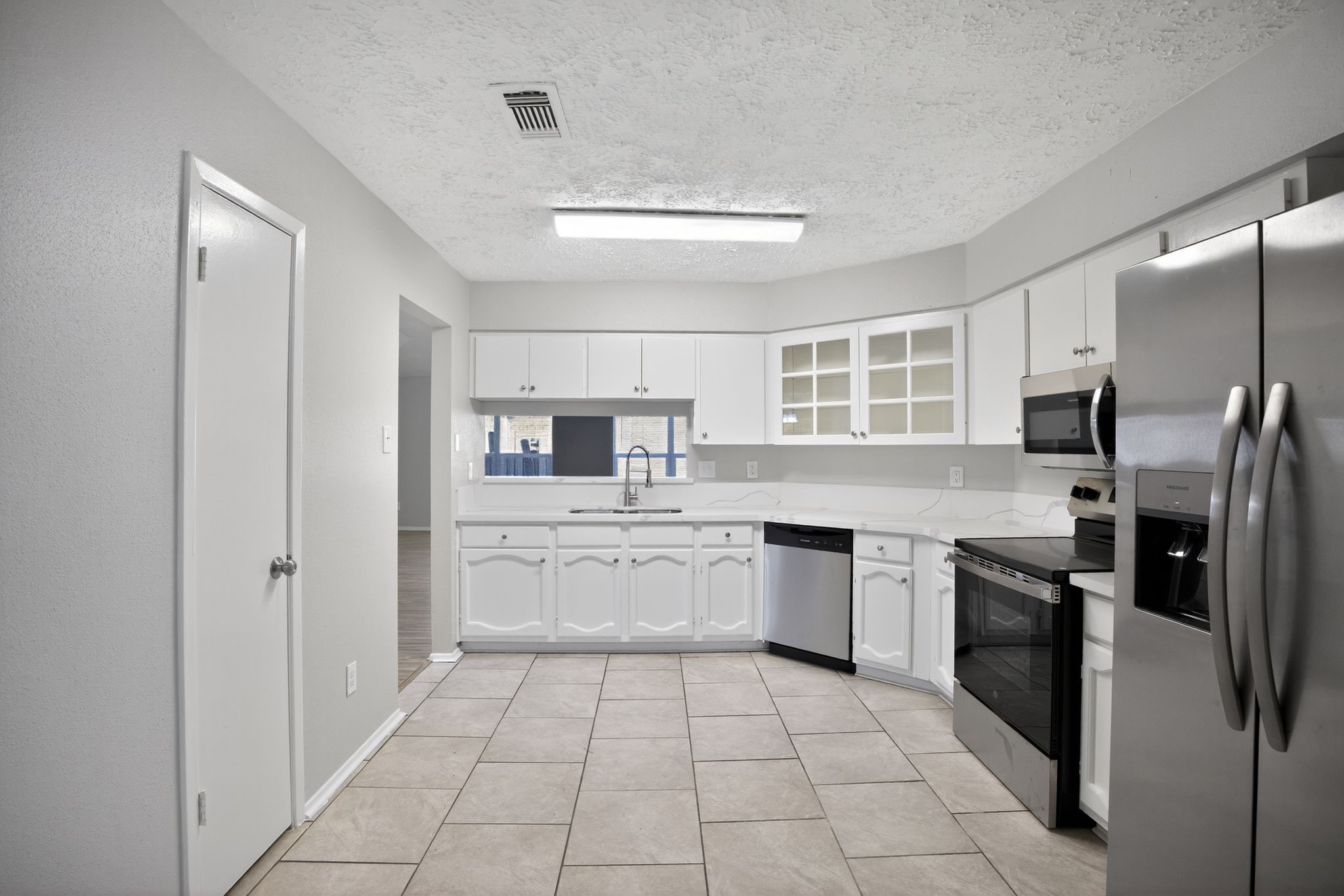 7311 Postwick Court Houston, TX 77095 - Photo 18 of 36 a kitchen with stainless steel appliances granite countertop a refrigerator and a sink