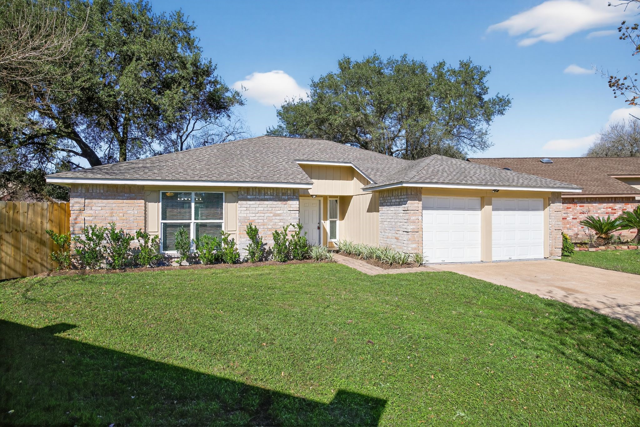 7311 Postwick Court Houston, TX 77095 - Photo 2 of 36 a front view of a house with a yard and garage