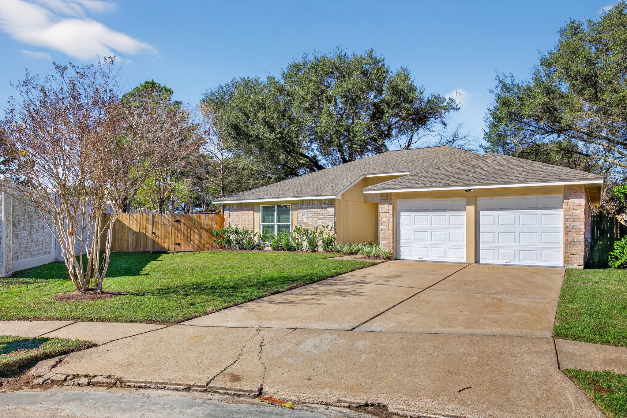 7311 Postwick Court Houston, TX 77095 - Photo 3 of 36 a front view of a house with a yard and a garage